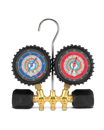 A dual-gauge HVAC refrigerant manifold gauge with a brass body, black caps, and two analog pressure gauges on a white background.